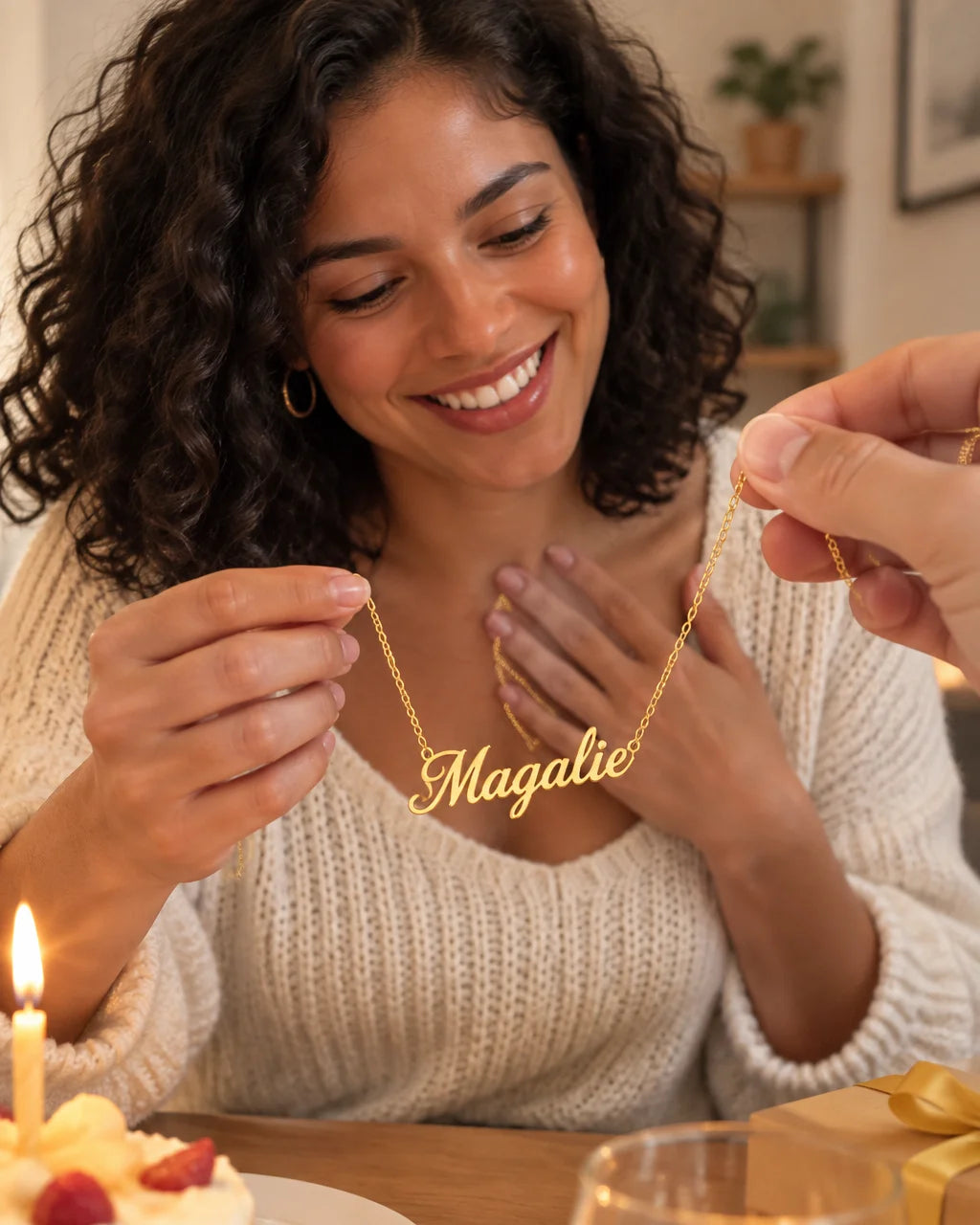 A gold stainless-steel personalized name necklace with a fine chain and cursive pendant, sharp and l