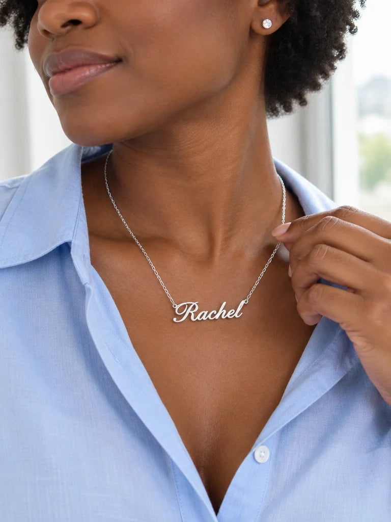 A silver-finish stainless-steel personalized name necklace with the same fine chain and continuous c