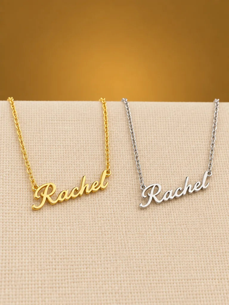 Two otherwise identical personalized name necklaces with the same fine chain and cursive pendant, al